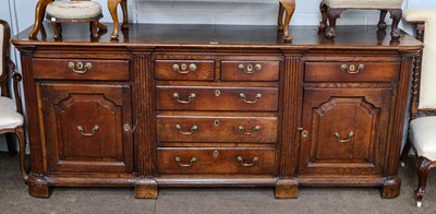 Lot 1206 - A George III oak dresser base with a central...