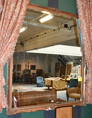 Lot 1146 - A reproduction gilt framed mirror with...