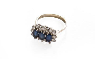 Lot 40 - A sapphire and diamond triple cluster ring,...
