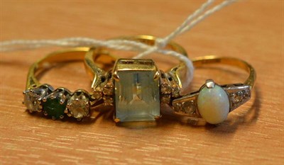 Lot 328A - An opal and diamond ring, circa 1930, an 18ct gold emerald and diamond three stone ring and a dress