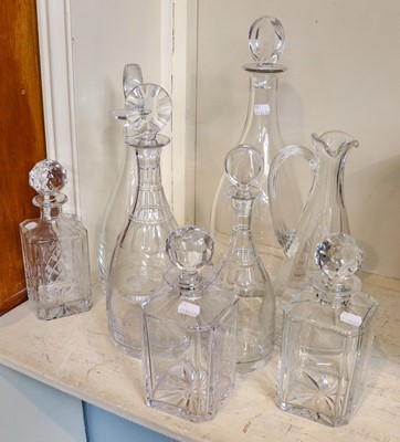Lot 241 - A group of four glass decanters by William...