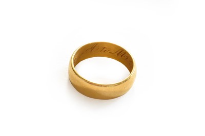 Lot 10 - A 22 carat gold band ring, finger size J