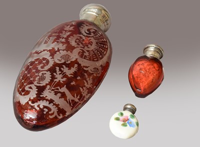 Lot 112 - A Victorian etched ruby glass scent bottle,...