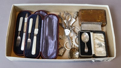 Lot 213 - Two silver baby rattles, a silver caddy spoon,...