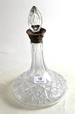 Lot 18 - A cut glass ship's decanter and stopper with silver collar