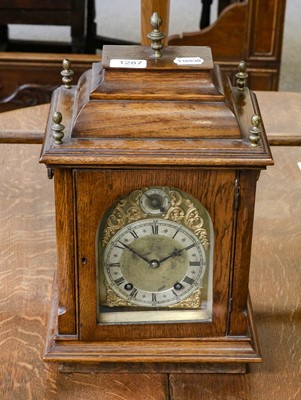 Lot 1287 - A German oak quarter striking table clock,...