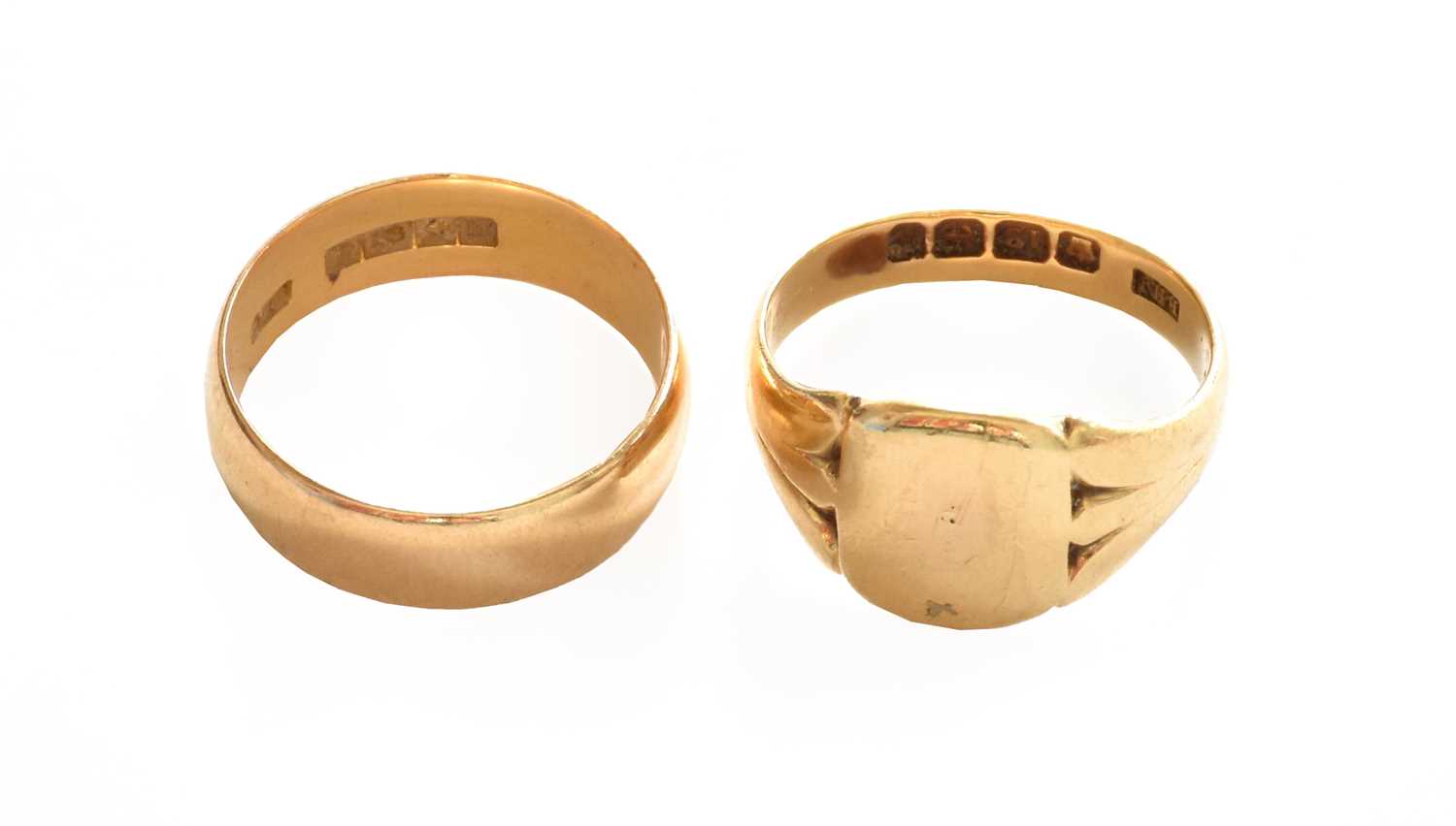 Lot 7 - An 18 carat gold band ring, finger size N; and...