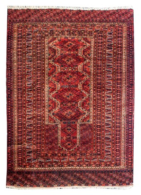 Lot 180 - An Afghan Turkman Prayer Rug, the scarlet...