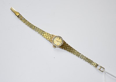 Lot 263 - A lady's 9 carat gold diamond set wristwatch,...