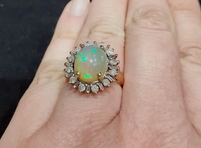 Lot 120 - A 9 Carat Gold Opal and Diamond Cluster Ring,...