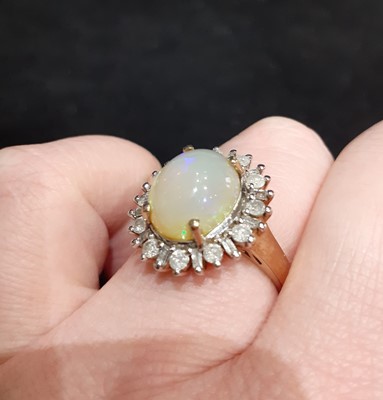 Lot 120 - A 9 Carat Gold Opal and Diamond Cluster Ring,...