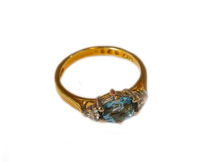 Lot 223 - An 18 carat gold aquamarine and diamond ring,...