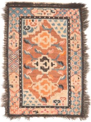 Lot 384 - Tibetan Rug, circa 1910 The light tan lozenge...