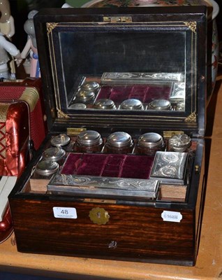 Lot 48 - A Victorian rosewood travelling dressing case with glass and silver plated fittings