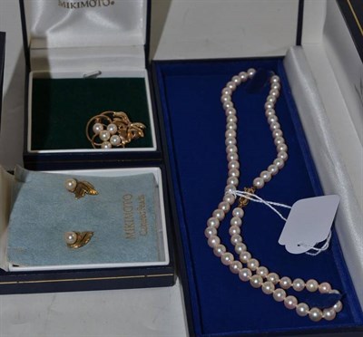 Lot 49 - A Mikimoto cultured pearl necklace, a 9ct gold Mikimoto cultured pearl brooch and a pair of...