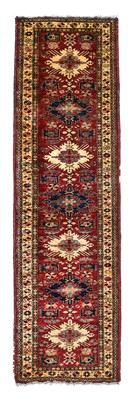 Lot 373 - Afghan Runner, modern The blood red field with...