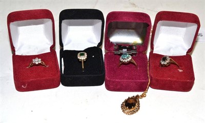 Lot 51 - Four 9ct gold stone set dress rings and a 9ct gold smoky quartz pendant on chain