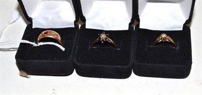 Lot 56 - Two 9ct gold diamond set dress rings and a 15ct gold ruby and diamond three stone ring