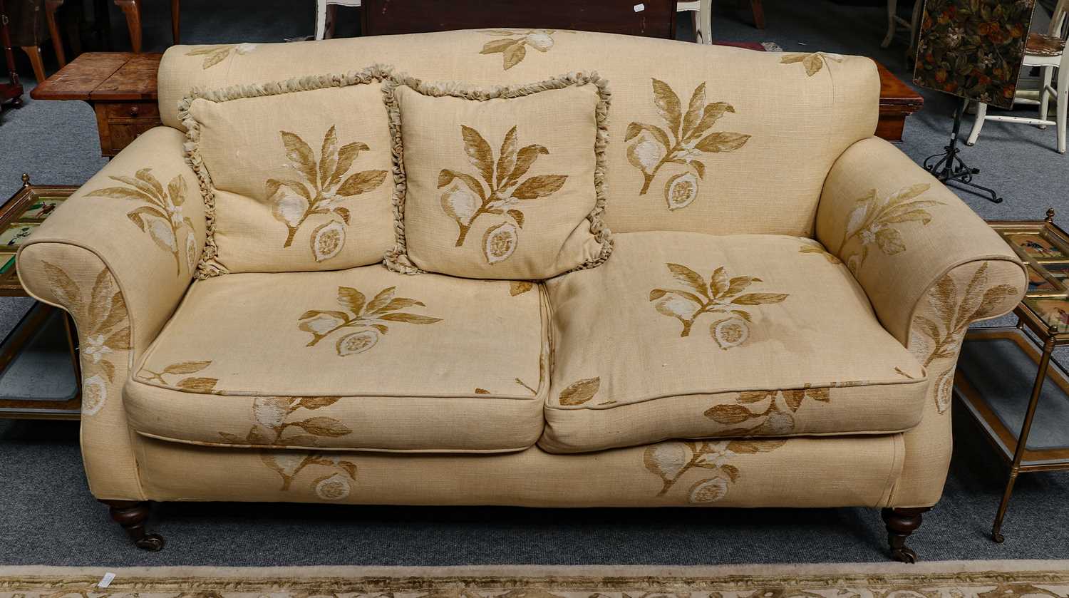 Lot 1160 - A shallow hump back three seater sofa on