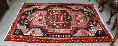 Lot 1113 - A Kurdish rug, the central medallion on an...