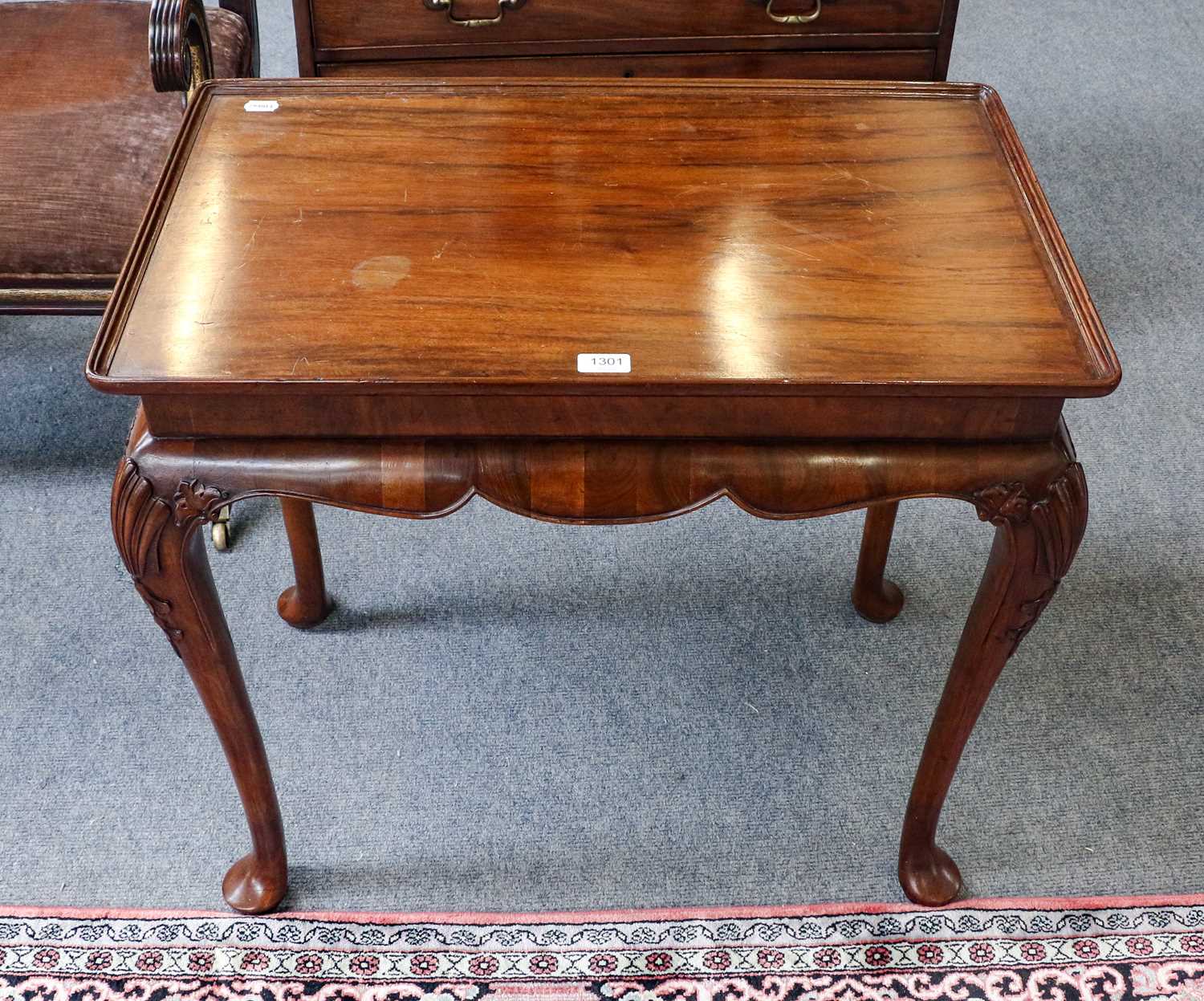 Lot 1301 - A Georgian style side table fitted with side...