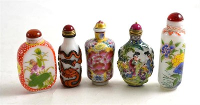 Lot 69 - Three Chinese glass snuff bottles and two porcelain snuff bottles of recent date (5)