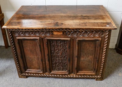 Lot 1268 - A carved and paneled oak marriage chest...