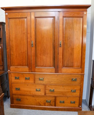 Lot 1262 - An early 20th-century mahogany triple wardrobe,...