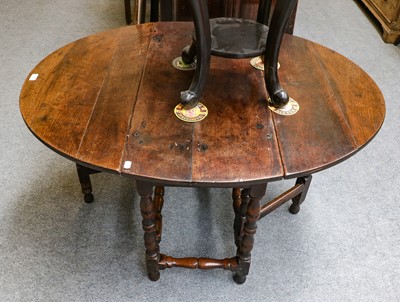 Lot 1273 - An early 18th-century oak gateleg table on...