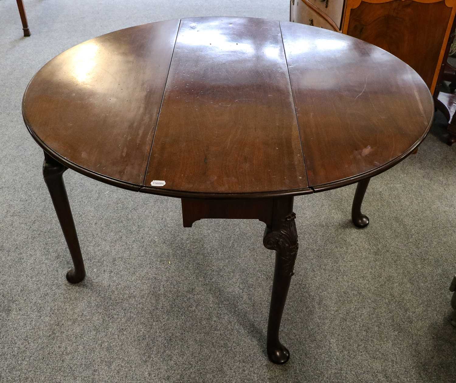 Lot 1318 - A George II mahogany gate leg table, the legs...