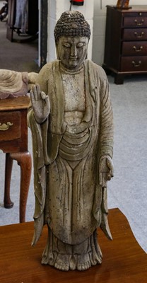Lot 1172 - A painted carved wooden standing Buddha, 63cm