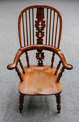 Lot 1222 - An early 19th century Yew wood Windsor chair,...