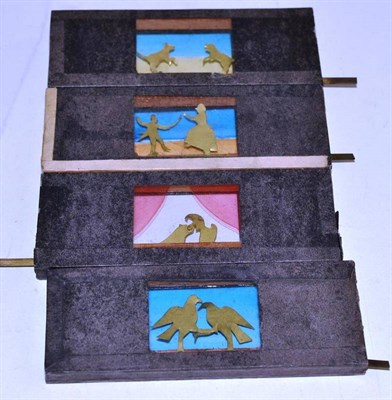 Lot 89 - Four 19th century hand operated slides with metal parts