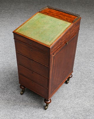 Lot 1204 - A 19th century mahogany Davenport of slender...