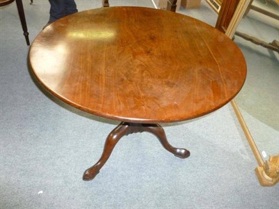 Lot 1187 - A George III Mahogany Supper Table, circa 1760, the circular one piece top above a bird cage...