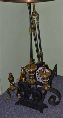 Lot 102 - Two pairs of brass andirons, fireside ornament and three fire implements (8)