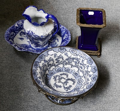 Lot 345 - A modern blue and white-footed bowl with metal...