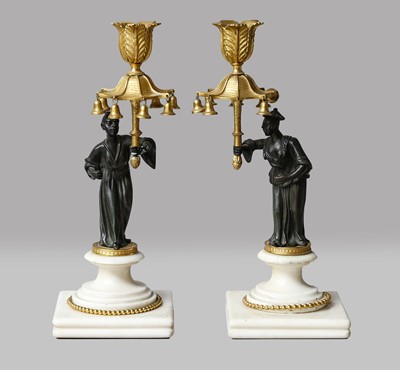 Lot 197 - A pair of French parcel-gilt bronze figural...