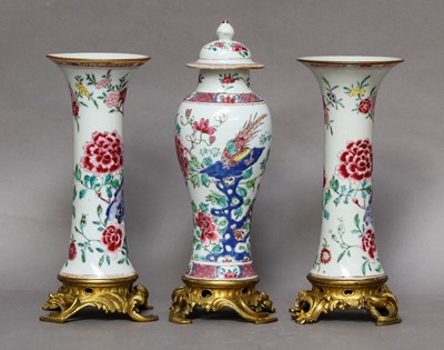 Lot 228 - A garniture of three Chinese famille rose...