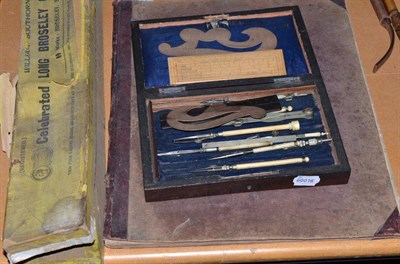 Lot 127 - Box Churchwarden's pipes, a Parish of Aldinghams records and a geometry set (3)