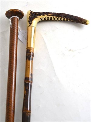 Lot 130 - Swaine & Adeney leather riding crop and an antler crop with 15ct gold collar