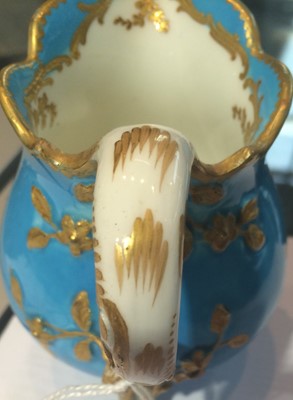 Lot 200 - A Sevres three-footed cream jug, 19th century,...