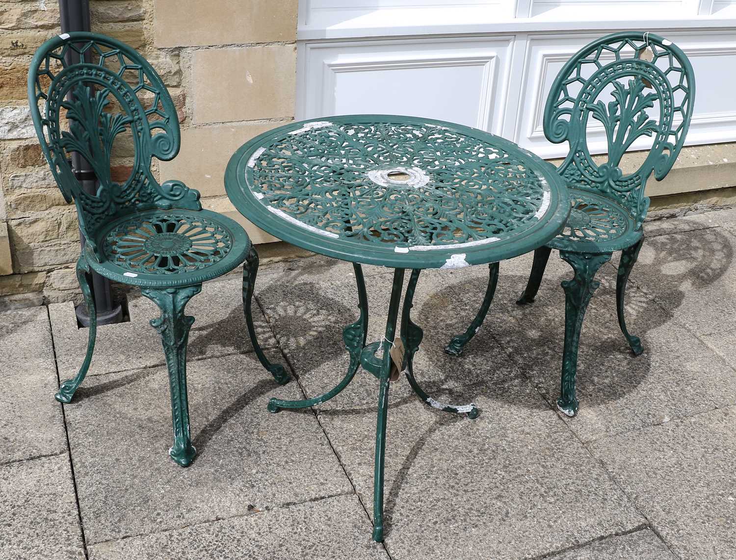 Lot 1114 - A pair of green painted metal garden chairs...