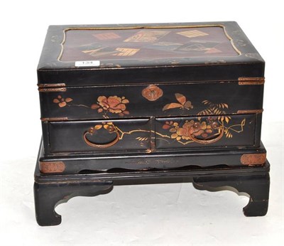 Lot 134 - A Japanese lacquer table cabinet and stand