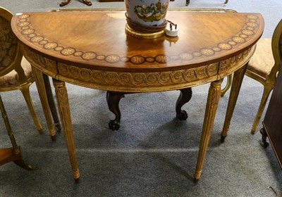 Lot 1205 - A Louis XVI style inlaid and gilt demi lune...