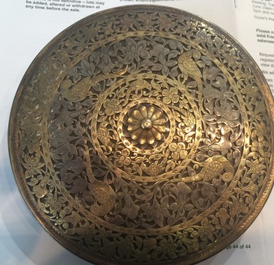 Lot 277 - An Indian brass and silver disc shaped box,...