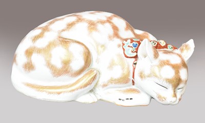 Lot 281 - A Japanese Kutani model of a sleeping cat,...