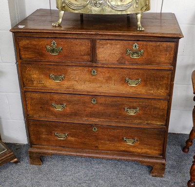 Lot 1229 - A George III oak four-height chest of drawers,...