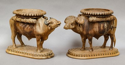 Lot 342 - A pair of South East Asian carved stands...