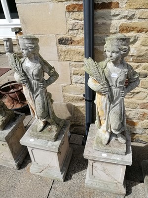 Lot 1118 - A pair of weathered composition garden statues...